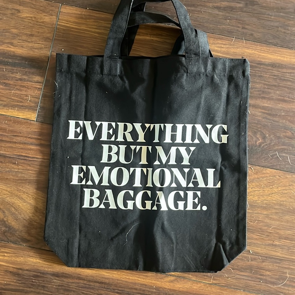 Everything but my emotional baggage black canvas tote bag